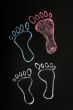Footprints symbol drawn with chalk on blackboard background