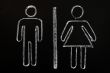 Men and women symbols drawn on blackboard background