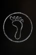 Chalk drawing of footprint symbol on blackboard background