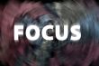 Focus word with motion rays on a chalkboard background 