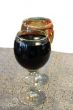 Two glasses on the table with a white tablecloth isolated on the