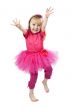 little girl in a pink dress dancing in studio