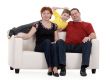 family with son sitting on a sofa