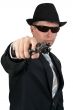 businessman in a hat and sunglasses with a gun