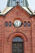 clock on the old brick Church