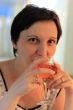 The glass of wine in the womans hands