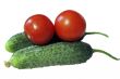 Red tomato and two cocumbers isolated on the white background