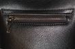 Zipper on dark brown leather hand bag