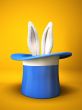 Blue top hat with rabbit ears  isolated on yellow background