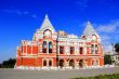 Landscape with historic theater and blue sky