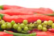 Multi-colored peppers on a white background