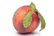 Fresh peach with leaves