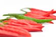 Multi-colored peppers on a white background