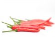 Red hot chili peppers on white background