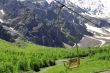 Empty cableway and caucasus mountains background