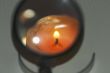 magnifying glass, a candle
