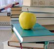 Apple on stack of books