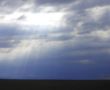 Dramatic sky and rays falling through the clouds