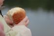 child taking a piece of bread