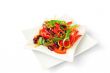 A salad of tomatoes, sweet peppers, red beans, carrots with sesa