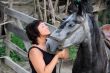 Portrait happy smiling woman with horse