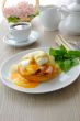 Boiled eggs poached with ham on a bun with sauce