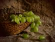 Green grapes in a basket.