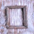 old photo frame on the cracked wall. 