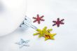 A silver christmas ball and snowflakes on a white background, ch
