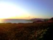 Sunset Over Farmland And Ocean