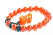 Red jade prayer beads on a white background