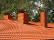 The roof is covered with orange tiles 