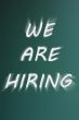 We are hiring - written on a green chalkboard background