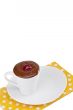 cup of melted chocolate on a plate  with cherry
