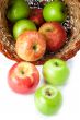 apples spilling out of basket