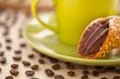 cropped image of pastry in saucer