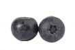 close up image of two blueberries