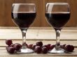 close up shot of red wine and grapes