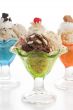 an ice cream on a cup with toppings 