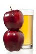 stack of apples and juice glass