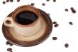 coffee cup and scattered beans