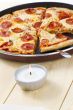 pizza on pan with spatula