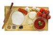 ingredients for homemade pizza on wooden board