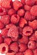 sweet raspberries on a white background 