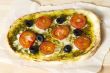 pizza with tomatoes and olives