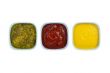 ketchup mustard pickles on bowl