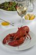 lobster dinner with wine and vegetable salad