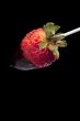 strawberry on the stick with chocolate dip