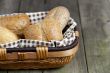 cropped image of assorted bread in basket