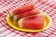 slices of watermelon on a picnic cloth 